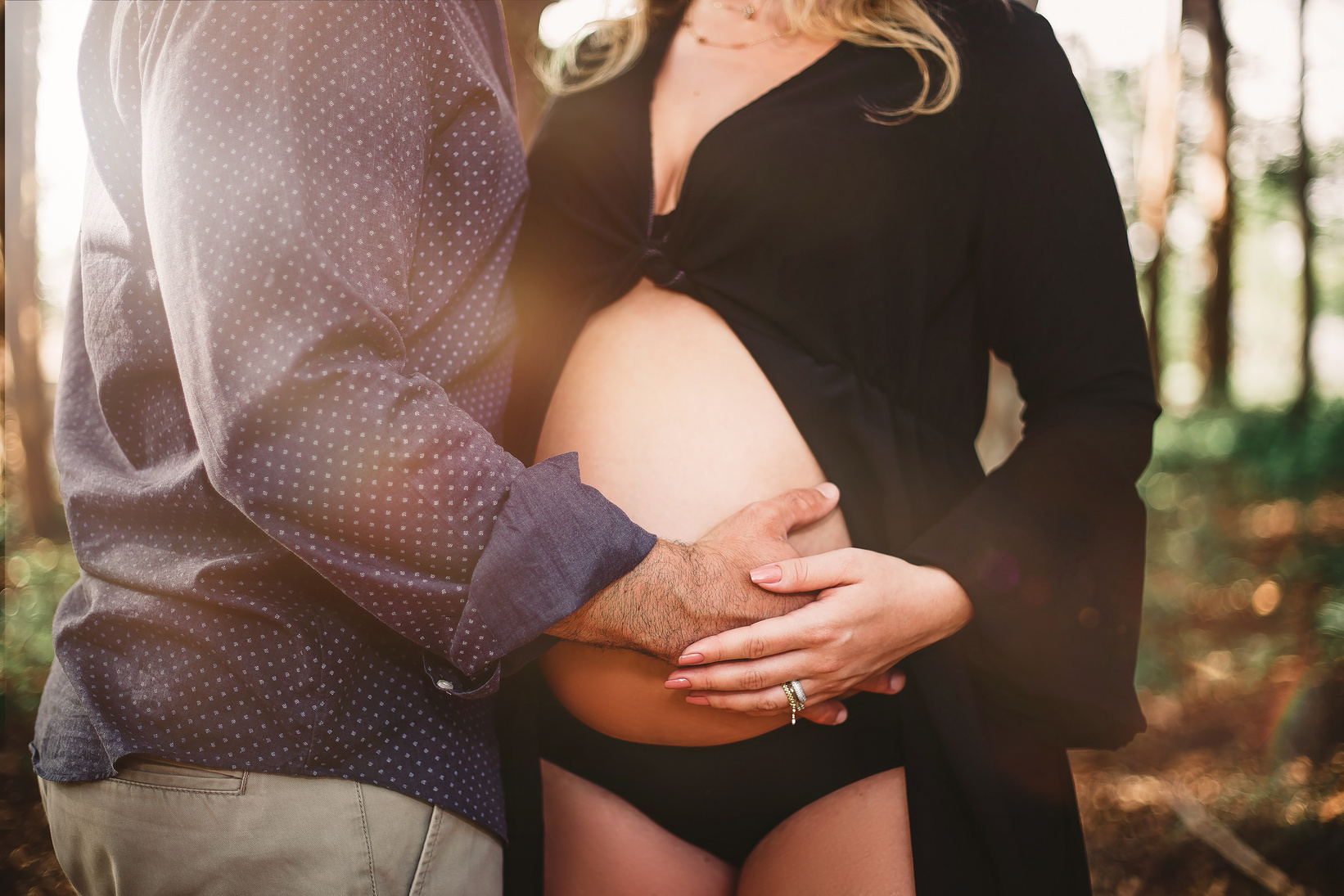 Man Touching Woman's Baby Bump